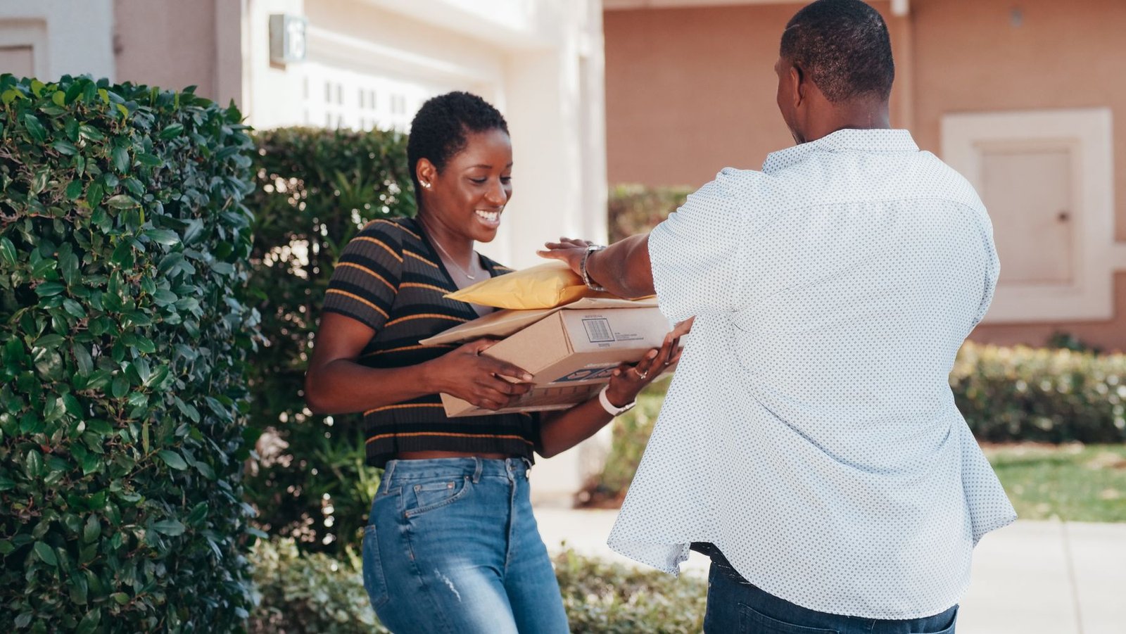 A parcel handed to a customer at their front door