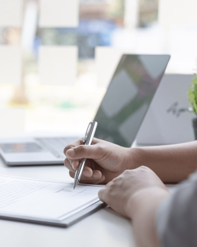 A claim response being completed and signed at a desk